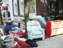 Eviction Reporting photo of furniture and household items on the curb